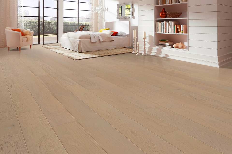 white oak hardwood in modern bedroom with peach tones